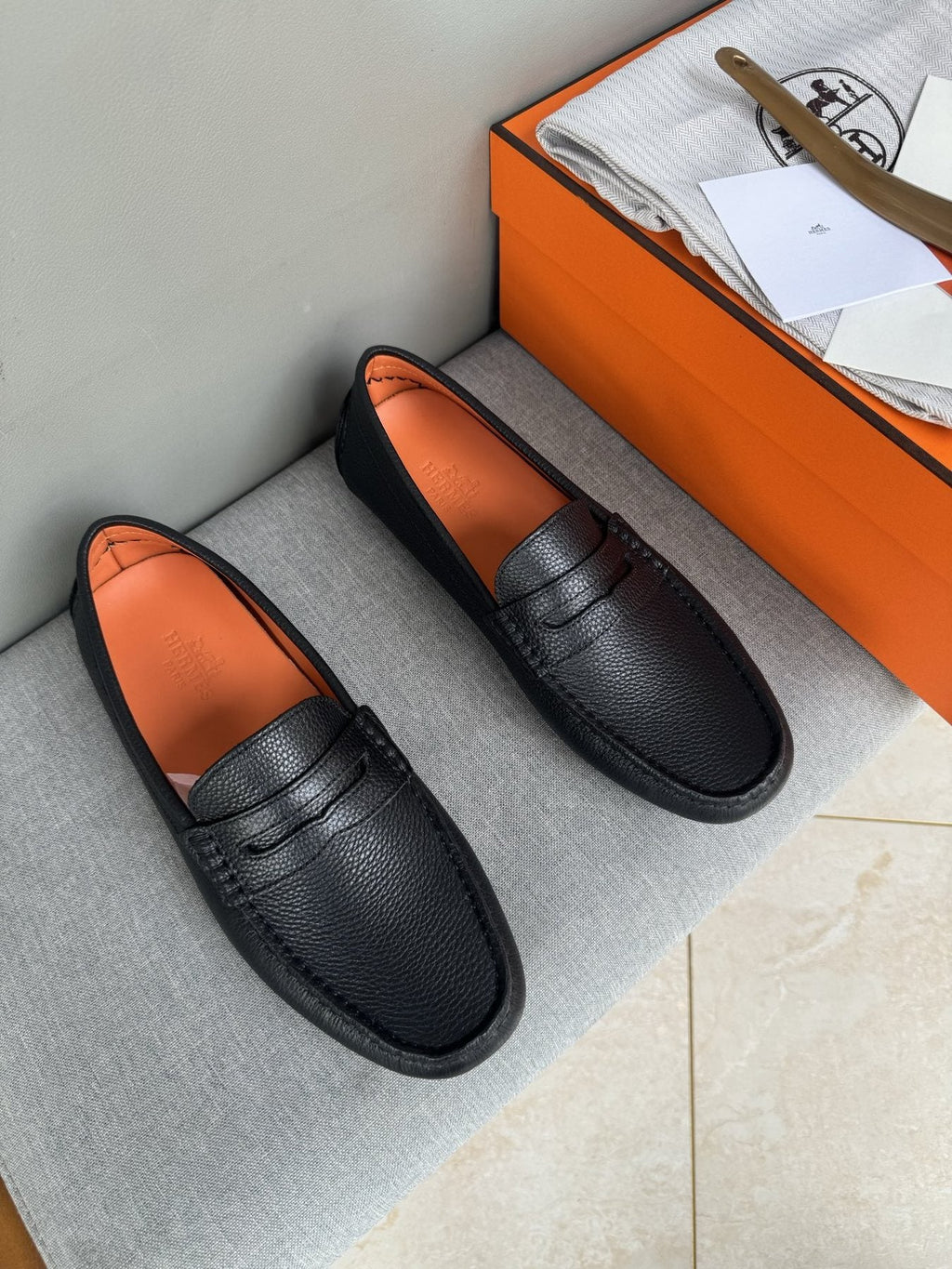 Hermès Black Textured Penny Loafers — front